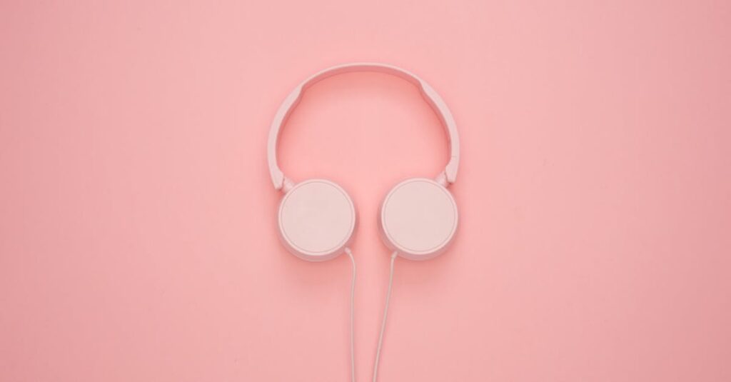 Aesthetic pink headphones on a pastel background, perfect for a modern and stylish look.